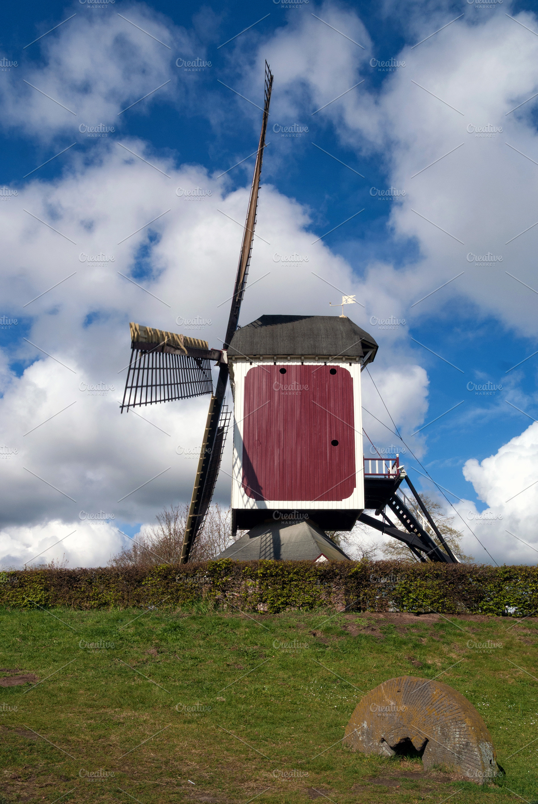 Millstone in front of the Oostenwind windmill, an Architecture Photo by John Stuij Photography