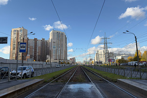 A view of railway tracks leading into the distance, flanked by modern buildings, an Industrial Photo by Textures & Backgrounds