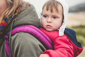Mother carrying her toddler featuring baby, family, and mother