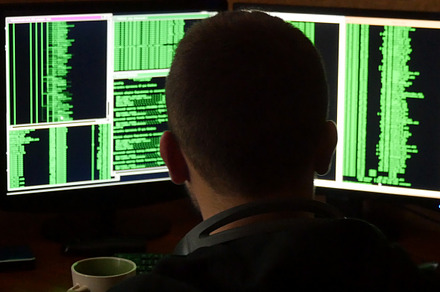 Hacker breaking code and drinking from the cup at your desk criminal hacker, a Technology Photo by Footage Autor