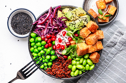 Healthy vegan food. Buddha bowl with quinoa, fried tofu, avocado, a Food & Drink Photo by 5PH