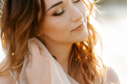bride against the background of a yellow sunset
