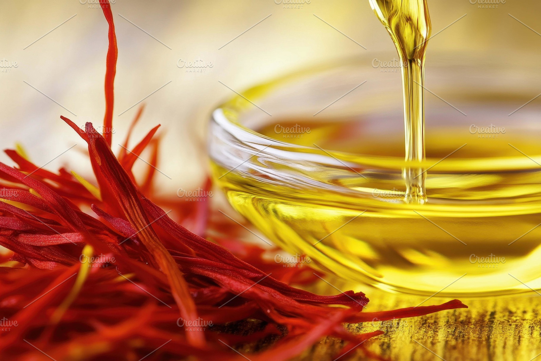Saffron strands next to golden oil i, a Photo by Tanuart