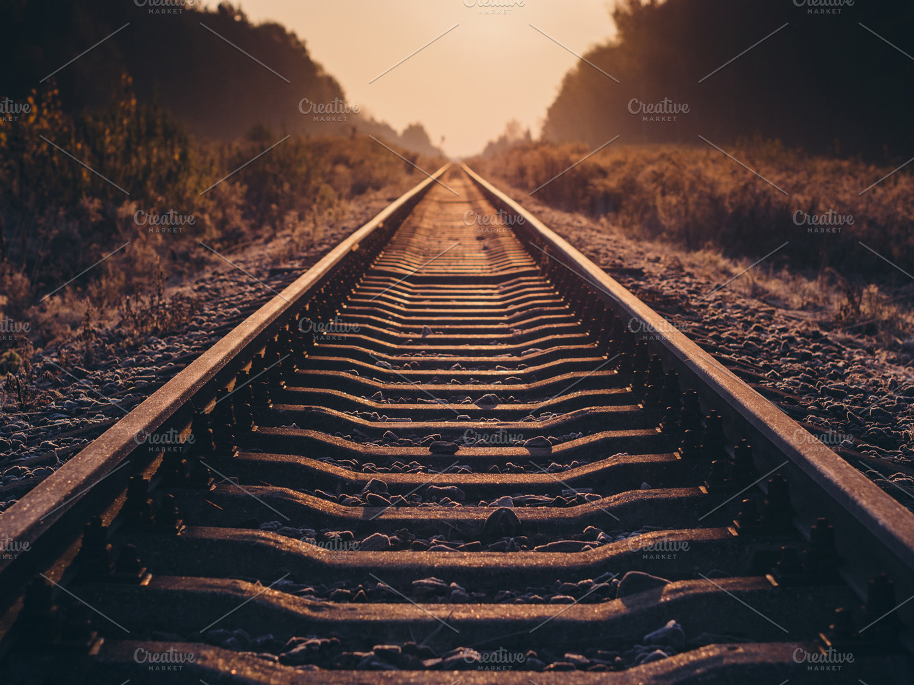 Railroad at sunrise featuring sunrise, sun, and sky, a Transportation Photo by Pawel Kadysz