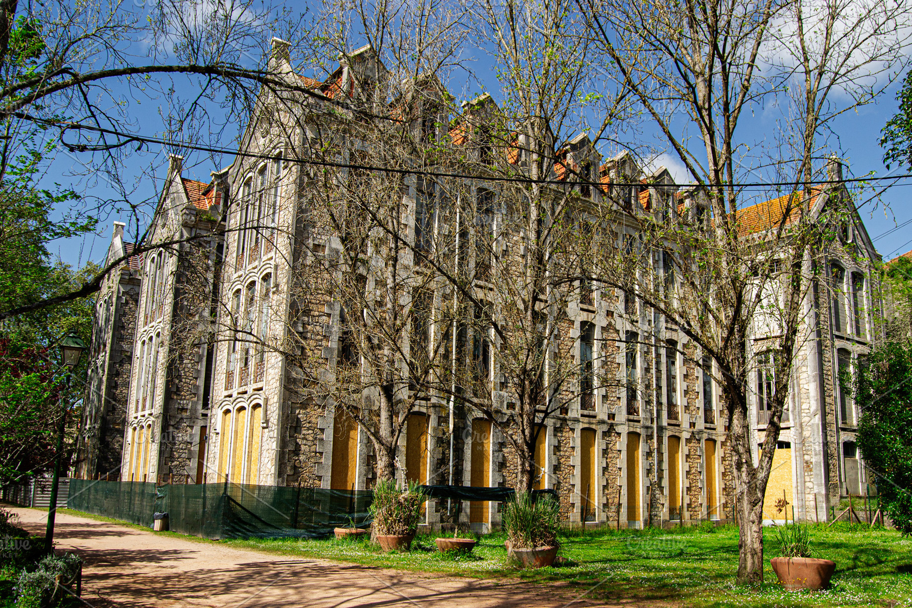 Old historic building surrounded by nature in Caldas da Rainha, Portugal, a Photo by AS photostudio