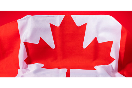 Canadian maple leaf flag on podium, a Holiday Photo by Lifemorning