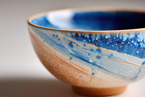 Blue and orange crackle glaze ceramic bowl close-up, a Food & Drink Photo by AlyaAnd