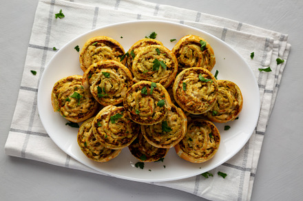 Homemade Chicken Pesto Pinwheels on a Plate, top view. Flat lay,, a Food & Drink Photo by LiudmylaChuhunova
