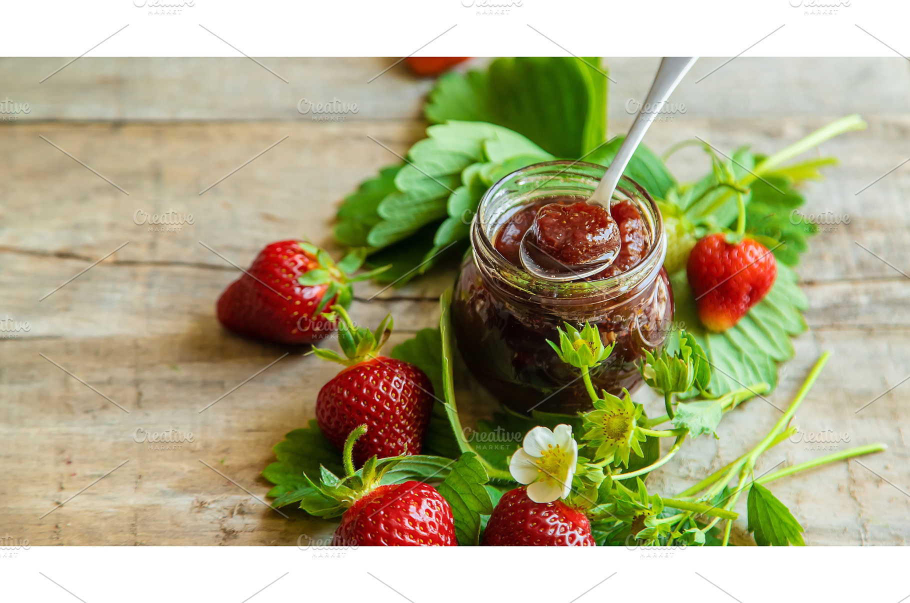 Homemade strawberry jam in a jar, a Food & Drink Photo by yanadjana