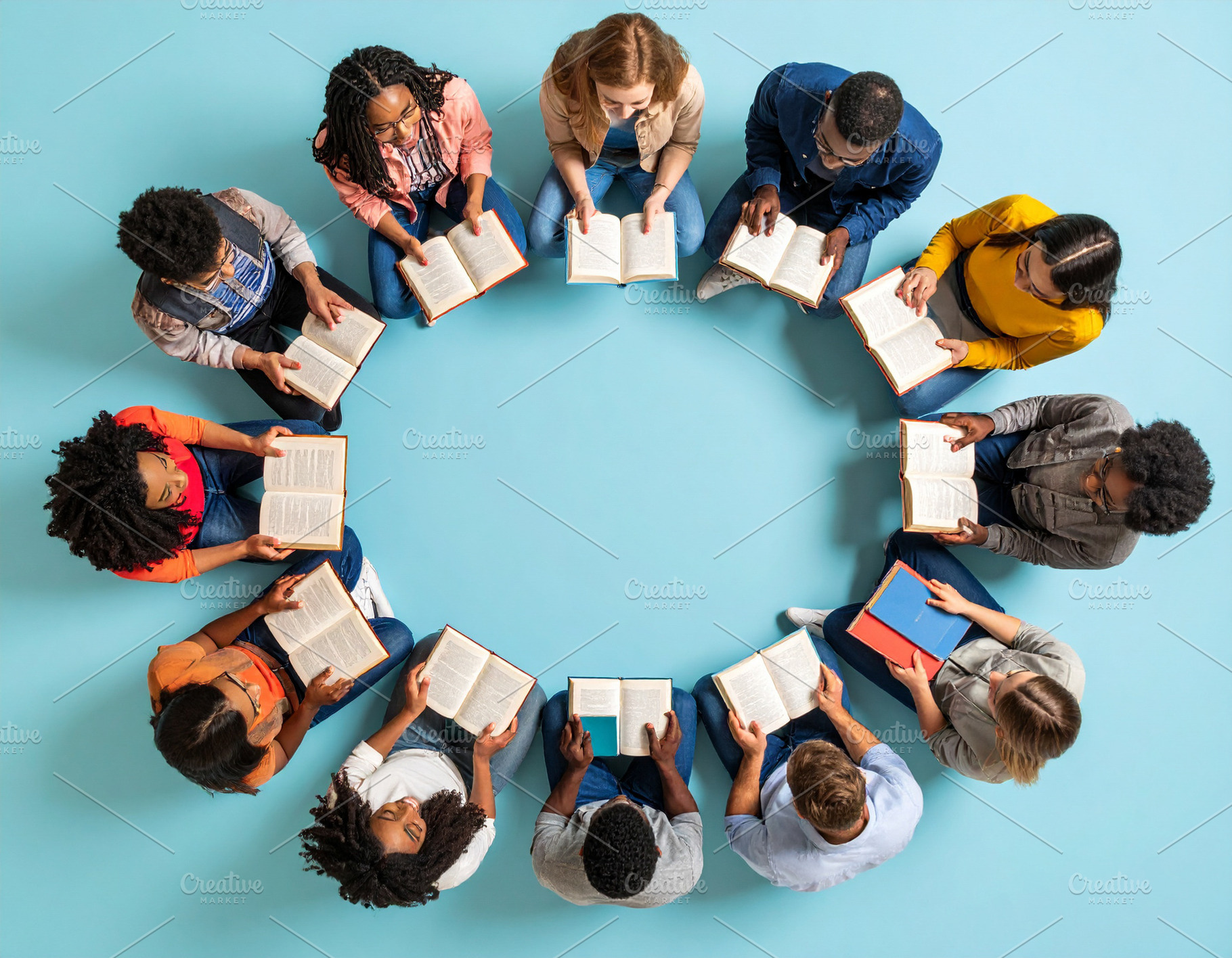 Diverse students holding books forming a circle at classroom gro, a School & Education Photo by DanFLCreativo