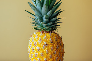 Ripe Pineapple on Yellow Background, a Food & Drink Photo by Pixeness Studio
