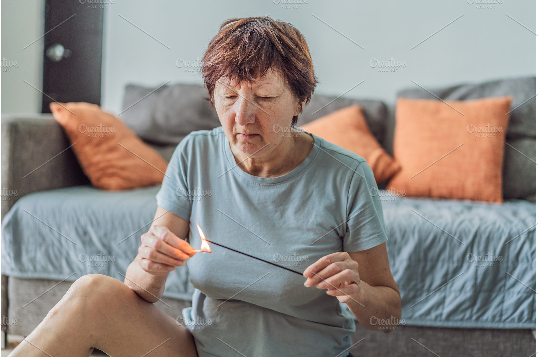 Older woman lighting an aromatic, a Beauty & Fashion Photo by Elizaveta Galitskaya