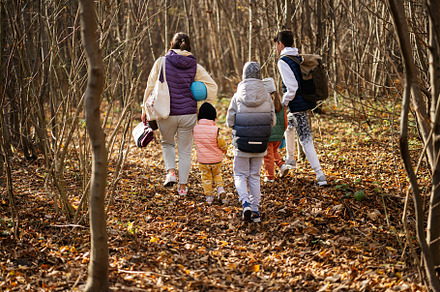 Mother with kids in family leisure at autumn activity in forest., a Person Photo by AS photostudio