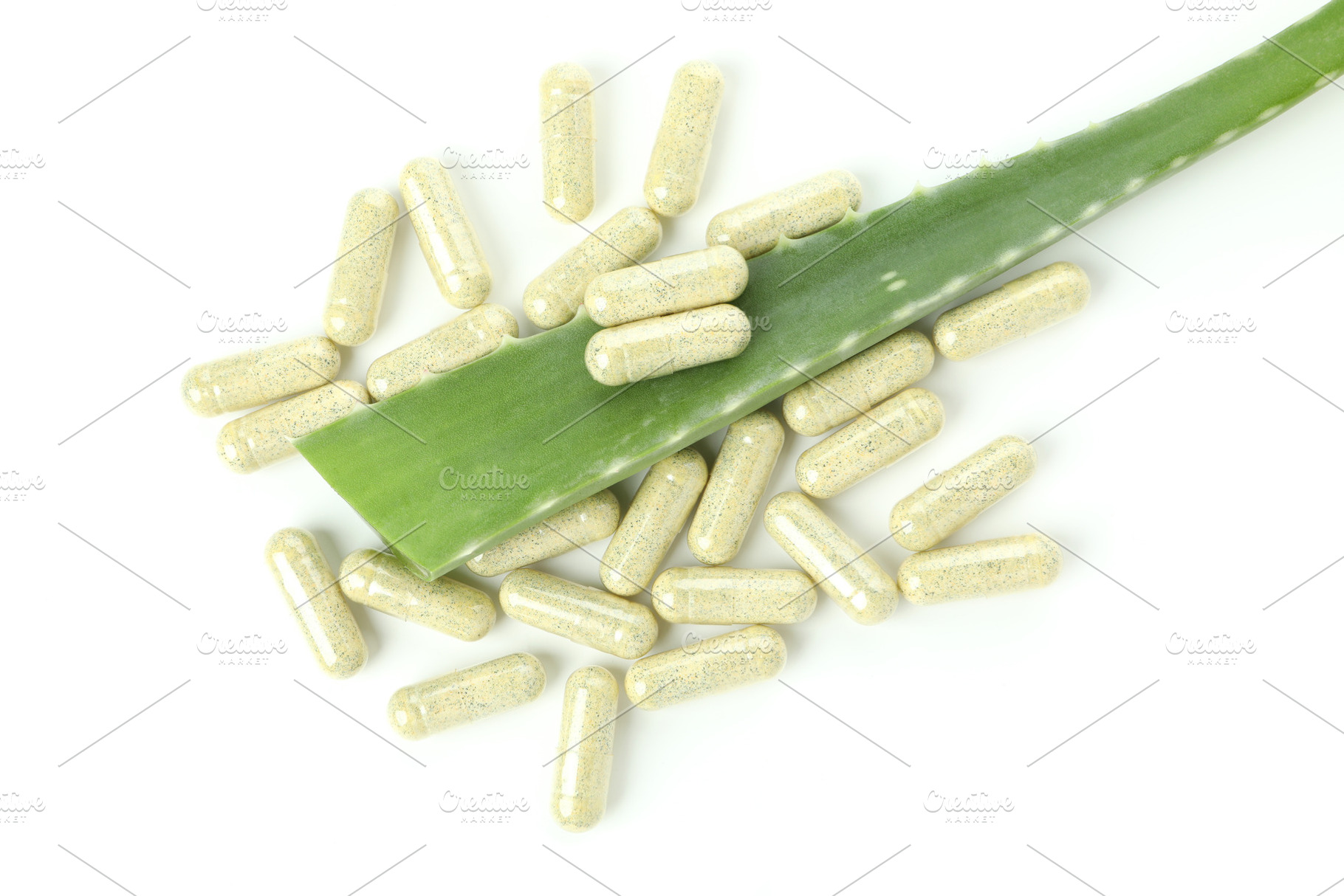 Aloe leaf and pills isolated on white background, a Beauty & Fashion Photo by AtlasStudio PRO