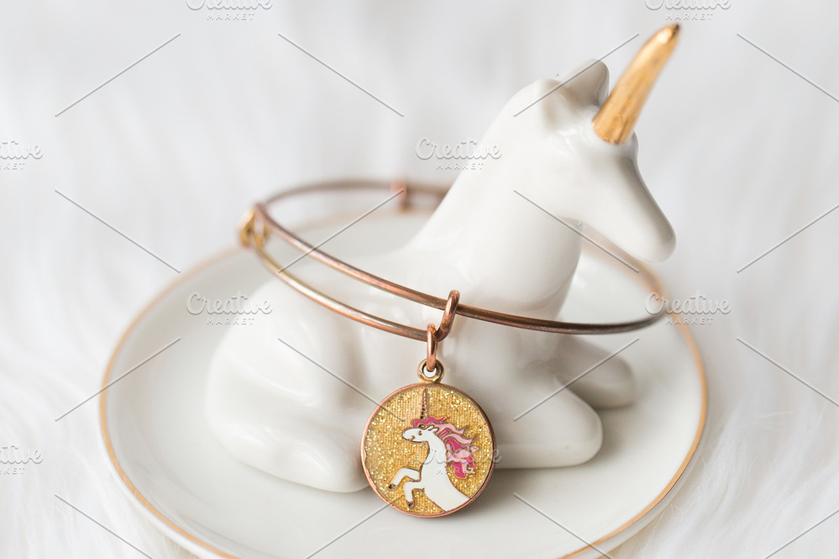 Unicorn jewelry dish + bracelet containing unicorn, white, and gold, a Beauty & Fashion Photo by Morgan Anderson (Photo 2 of 2)