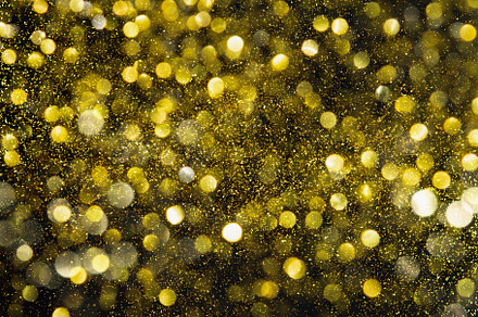 Blurred glitter bokeh background containing background, christmas, and gold