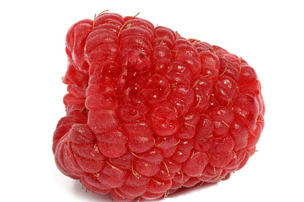 Ripe red raspberry on a white isolated background, a Food & Drink Photo by ndanko