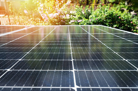 Solar panel on green flower background, a Technology Photo by PixieMe