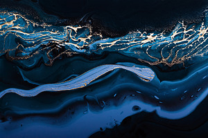 Fluid Art. Liquid Metallic Gold in abstract blue wave. Marble effect background, a Photo by colnihko