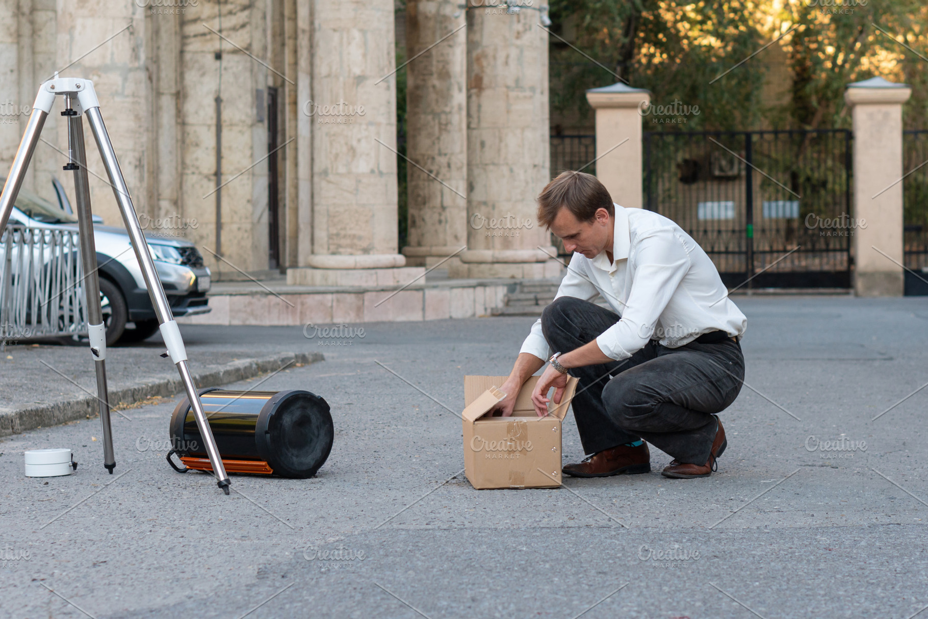 Man preparing telescope equipment, a School & Education Photo by Elena Vagengeim