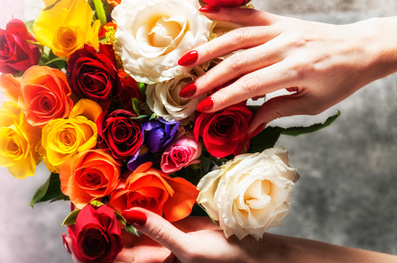 Red manicure nails and bright roses stock photo containing nails and manicure, a Beauty & Fashion Photo by MAnuta