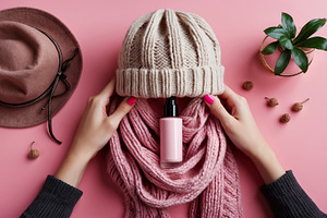 Pink Cosmetic Bottle in Knitted Scar, a Beauty & Fashion Photo by Stock Shape