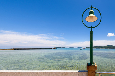 Sea and beach of laem panwa cape containing sea, beach, and lamp, a Nature Photo by yongkiet jitwattanatam