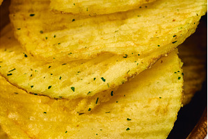 Golden potato chips are layered, a Food & Drink Photo by darksoul72