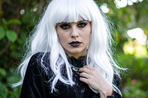 beautiful young goth woman outdoor, AI generated, a Photo by WorldOfPhotos