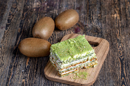 fresh and sweet green cake with sliced green kiwi fruit, a Photo by MyPhotos