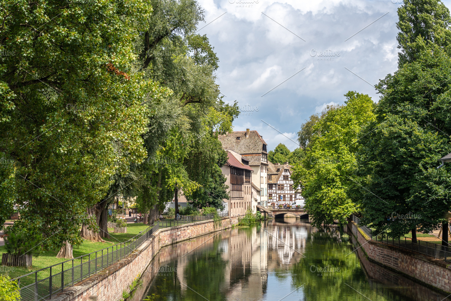 Canal and trees in Petite France Strasbourg, France, an Architecture Photo by GoodGoods