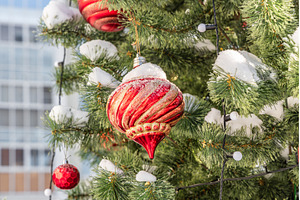 Green plastic Christmas tree outside, a Holiday Photo by Illustrations&photos