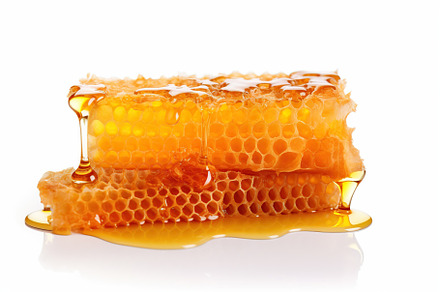 Honeycomb and honey on white background, a Food & Drink Photo by AlyaAnd