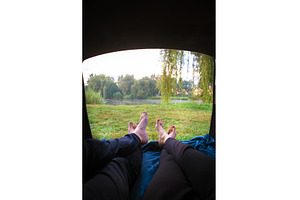 Man and woman relaxing in the trunk, a Person Photo by Artsaba Family