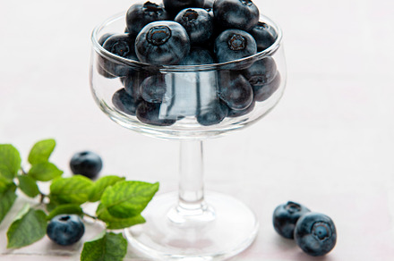 Blueberries on tile background, a Food & Drink Photo by Olena Rudo