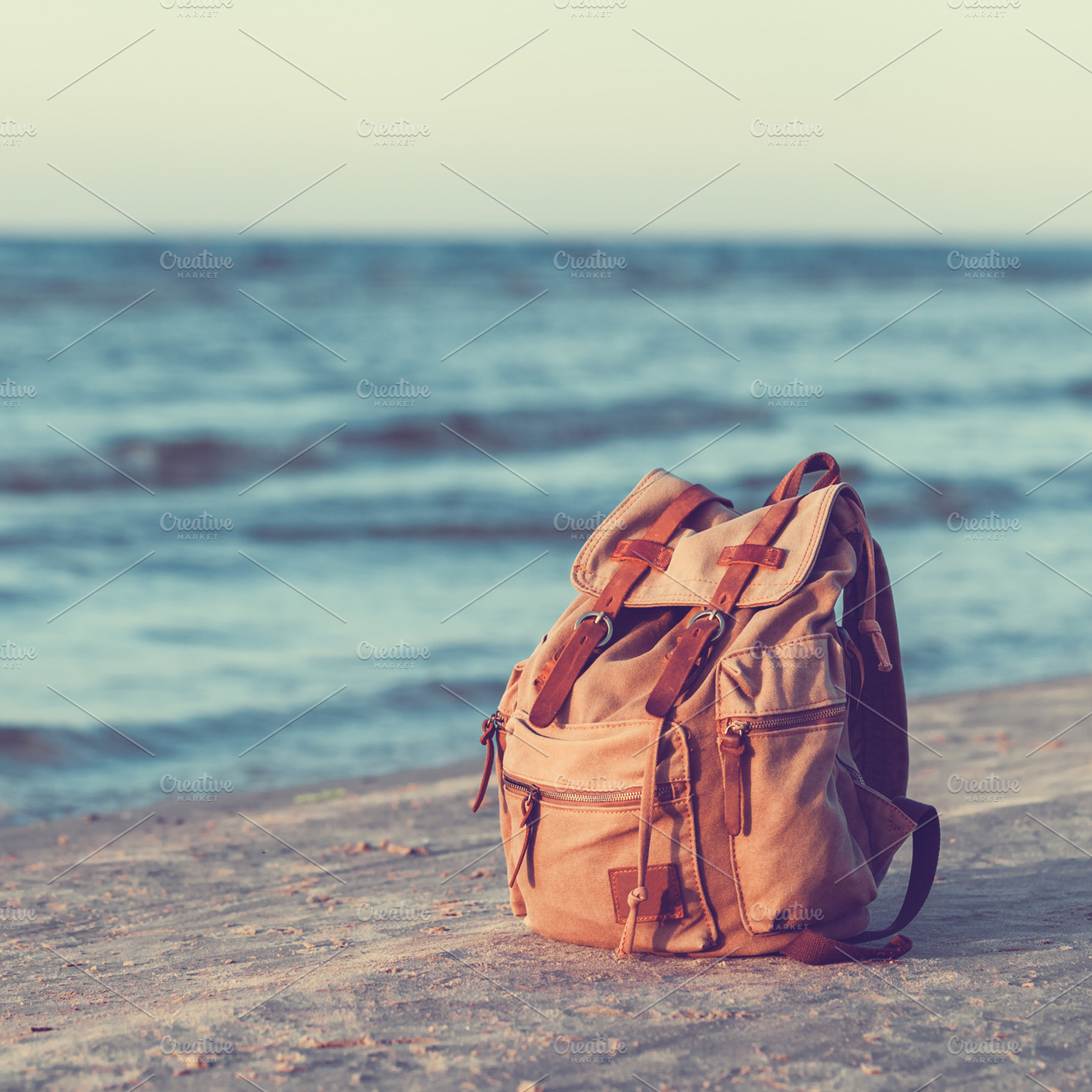 Backpack on Sea Beach, a Nature Photo by chamillewhite | Creative Market