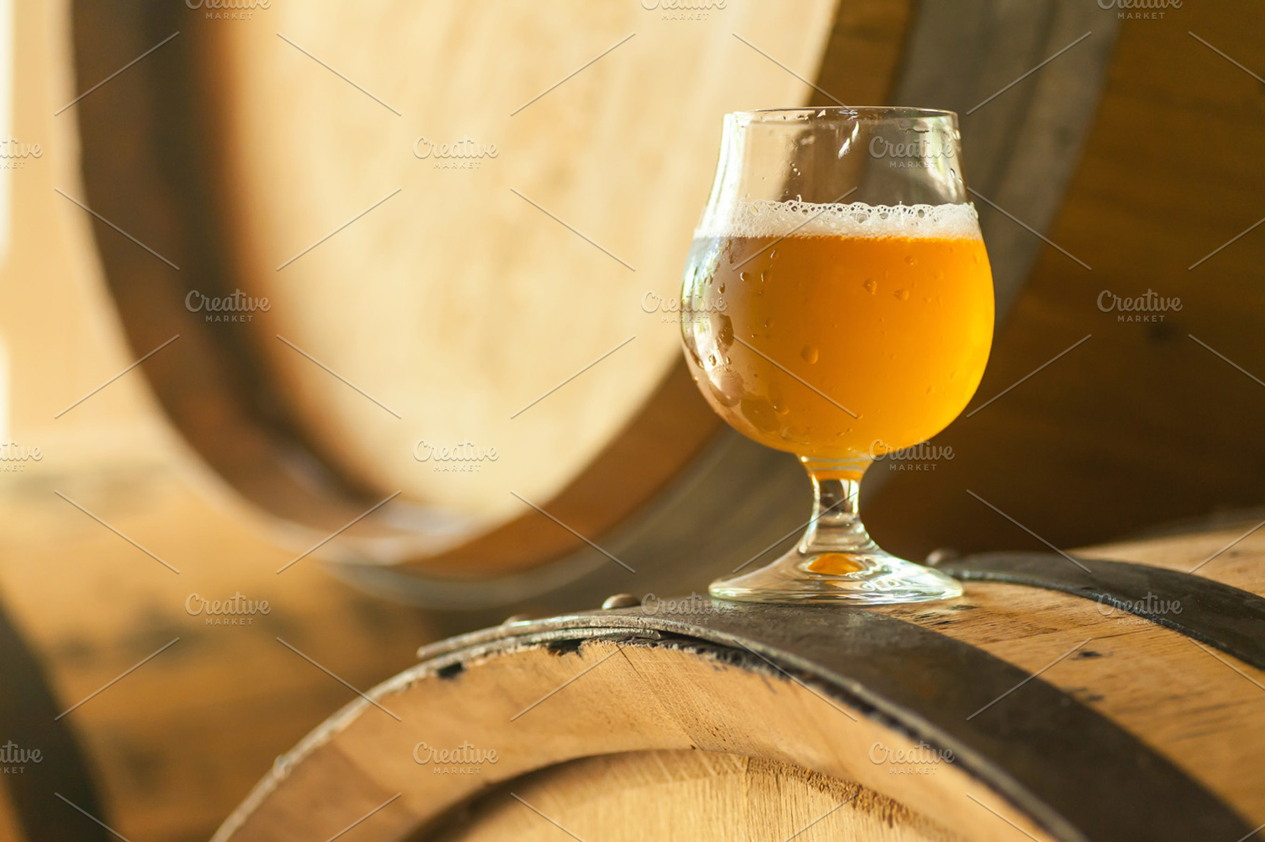 Light beer on a barrel featuring alcohol, ale, and amber, a Food & Drink Photo by Hidden Hallow
