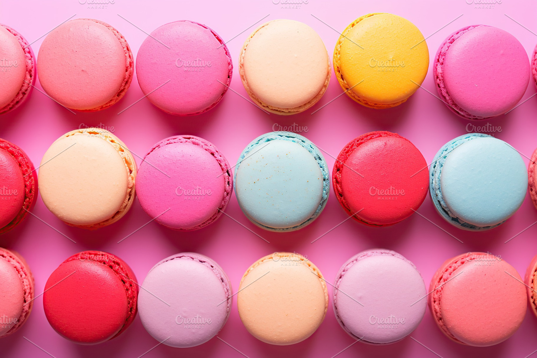 Colorful macarons dessert on pink background, a Food & Drink Photo by AlyaAnd