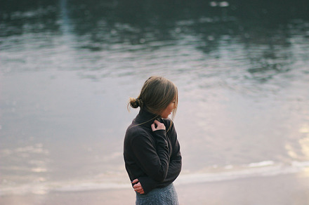 Lady on the river bank containing adult, attractive, and background
