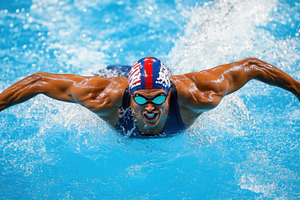Swimmer does butterfly stroke, a Photo by Beautiful things