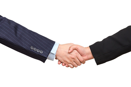Hand shake between a businessman stock photo containing hand and agreement, a Business Photo by Tzido Gallery