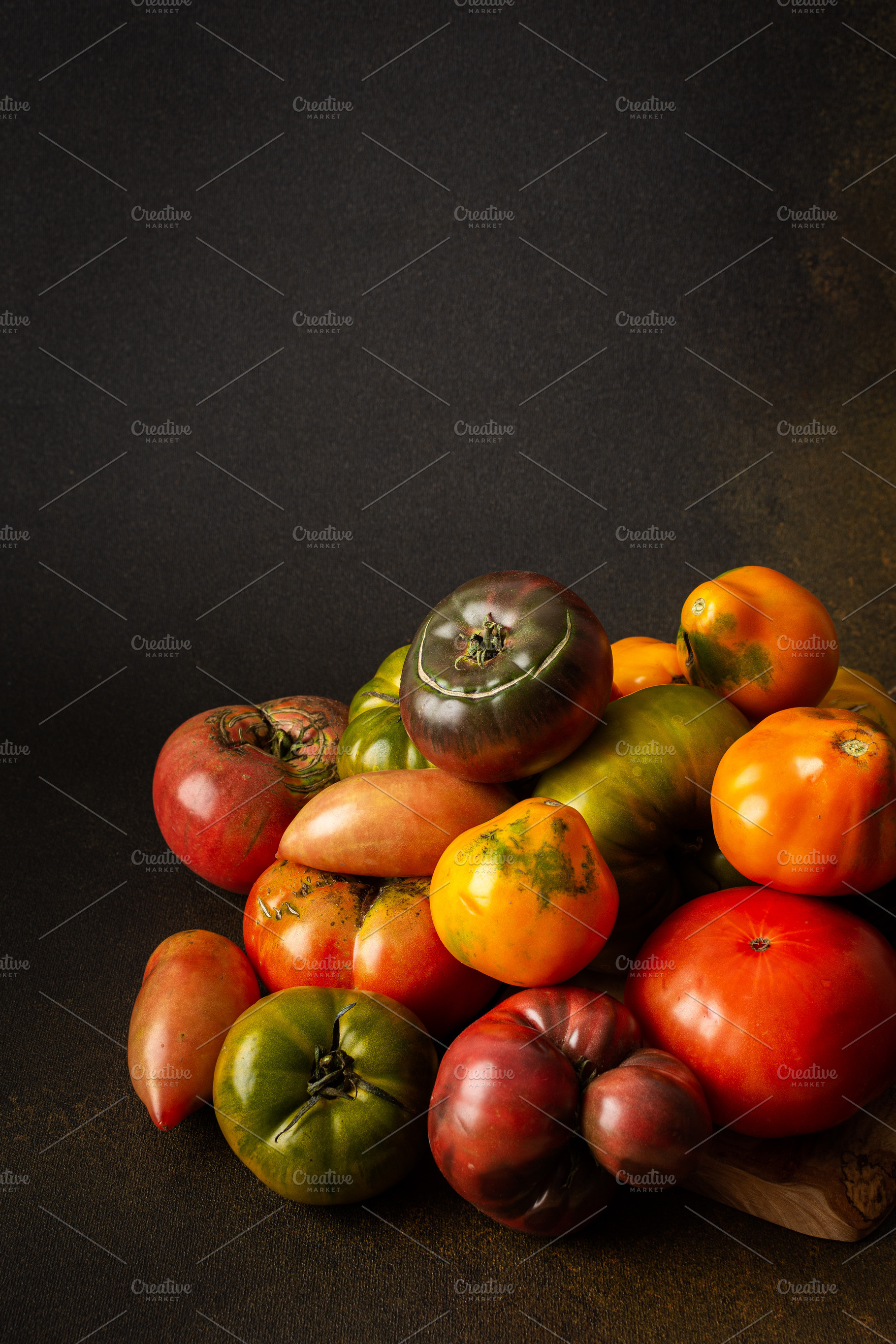 Tomatoes of different varieties, a Food & Drink Photo by Pandateam