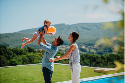 Happy parents playing with toddler