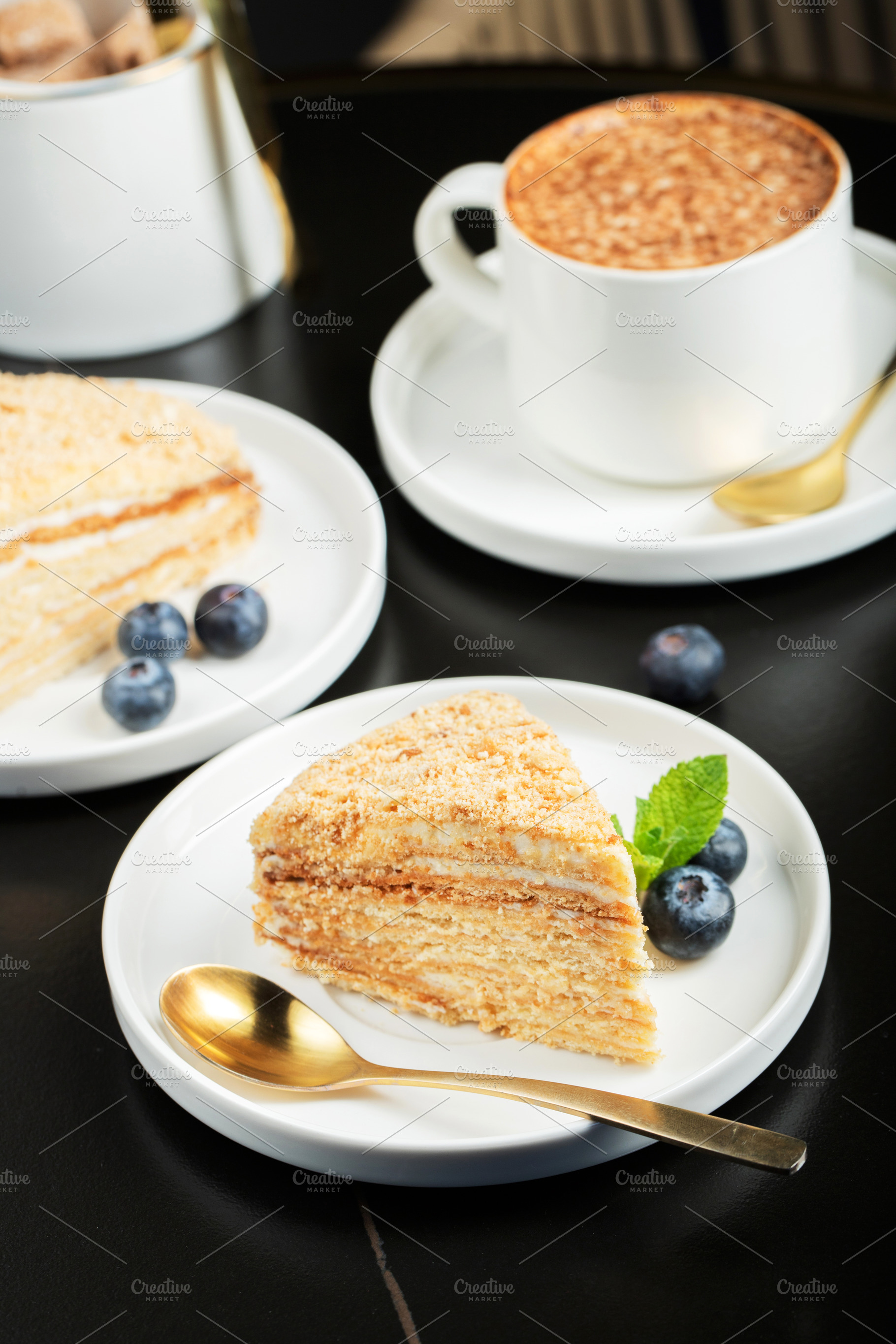 Medovik. Honey cake made from honey cakes with whipped sour crea, a Food & Drink Photo by Budarinphoto