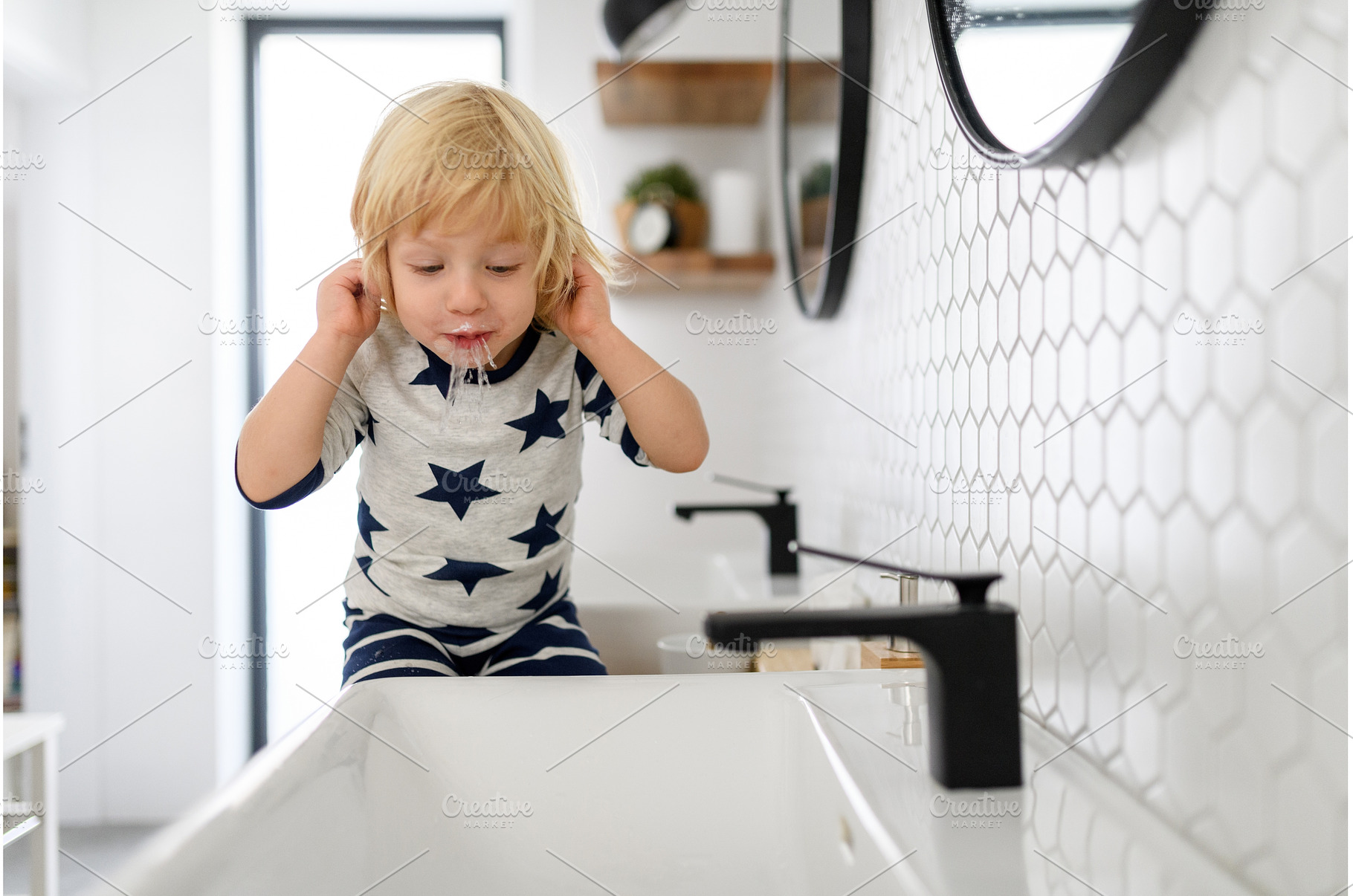 Boy spitting toothpaste and water, a Nature Photo by HalfPoint