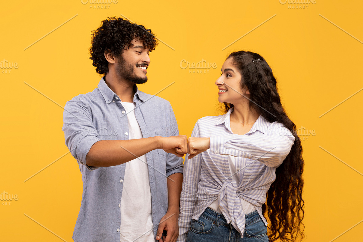 Partnership and collaboration work as team. Young indian woman and man making f, a Photo by Prostock-Studio (Photo 2 of 3)
