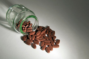Pill Bottle With Tablets, a Health & Medical Photo by THP Creative