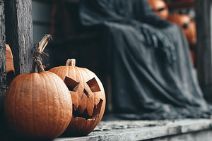 Two carved pumpkins on a wooden, a Holiday Photo by MistyDay