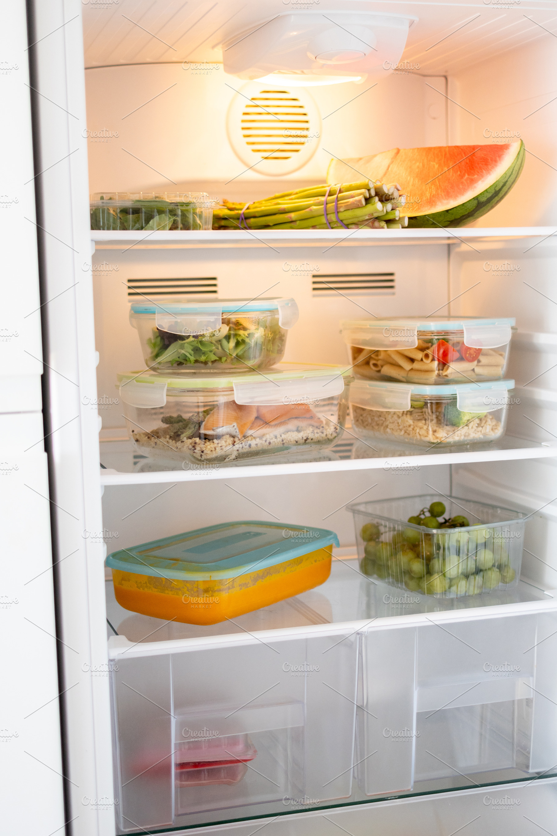 Organized refrigerator filled with healthy food and meal prep containers, a Food & Drink Photo by etorres69