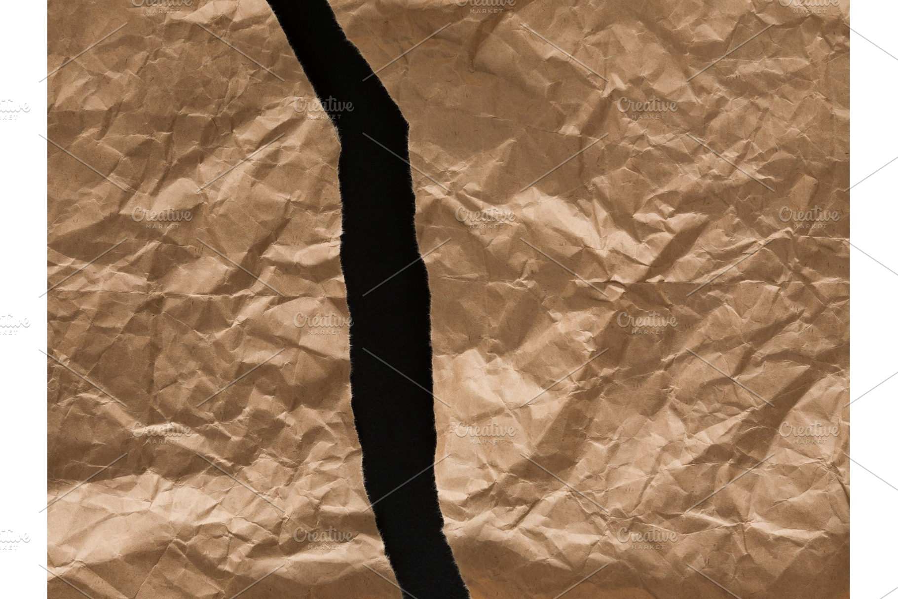 Crumpled and torn craft wrapping, an Abstract Photo by Prostock-Studio